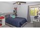 Bedroom featuring a plush bed, collectibles shelves, and a window providing natural light at 2295 Piedmont Ridge Ct, Marietta, GA 30062