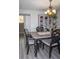 Charming dining room features a decorative chandelier, wood floors, wainscoting, and a decorative cabinet at 2295 Piedmont Ridge Ct, Marietta, GA 30062