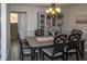 Charming dining room features a decorative chandelier, wood floors, wainscoting, and a decorative cabinet at 2295 Piedmont Ridge Ct, Marietta, GA 30062