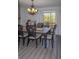 Charming dining room with sliding doors leading to a deck and complemented by stylish decor and wood floors at 2295 Piedmont Ridge Ct, Marietta, GA 30062