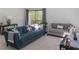 Comfortable living room with plush sofas, side tables, and large window offering a view of the outdoors at 2295 Piedmont Ridge Ct, Marietta, GA 30062