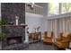 Living room with stone fireplace and white staircase in the background at 2295 Piedmont Ridge Ct, Marietta, GA 30062