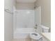 Cozy bathroom features a shower-tub combination with white tile surround at 6330 Phillips Pl, Lithonia, GA 30058