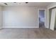 Bedroom boasts neutral paint and carpet with walk in closet and ceiling fan at 6330 Phillips Pl, Lithonia, GA 30058
