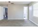 Bedroom features neutral paint, plush carpet and a view into the bathroom at 6330 Phillips Pl, Lithonia, GA 30058