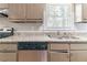 Functional kitchen showcasing countertop space, a stainless steel sink, and an open window at 6330 Phillips Pl, Lithonia, GA 30058