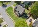 Lush, landscaped backyard with mature trees, play area, and large manicured lawn at 1005 Anise Ct, Dacula, GA 30019