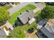 Expansive backyard featuring lush green grass, mature trees, trampoline, and a covered patio area at 1005 Anise Ct, Dacula, GA 30019