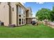 Back exterior featuring a deck and large windows providing ample natural light at 1005 Anise Ct, Dacula, GA 30019