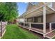 Inviting backyard with an extensive pergola-covered deck area, hot tub, and a play set at 1005 Anise Ct, Dacula, GA 30019