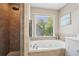 Bathroom boasts a separate glass shower and a jetted tub with jets at 1005 Anise Ct, Dacula, GA 30019