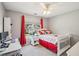 Bright bedroom with a ceiling fan, study desk, and sunny window views at 1005 Anise Ct, Dacula, GA 30019