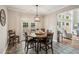 Cozy dining area with backyard access and beautiful views of the living room at 1005 Anise Ct, Dacula, GA 30019