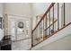 Bright foyer with staircase, hardwood floors, and a view of the front door at 1005 Anise Ct, Dacula, GA 30019