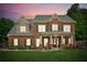 Stately brick home with a manicured lawn, classic shutters, and a welcoming front porch at 1005 Anise Ct, Dacula, GA 30019