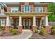 Inviting front porch with seating area, decorative wreath, and charming curb appeal at 1005 Anise Ct, Dacula, GA 30019