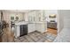 Modern kitchen with stainless steel appliances and views of the dining and living areas at 1005 Anise Ct, Dacula, GA 30019
