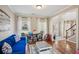 Bright, stylish living room with hardwood floors, large windows, and neutral walls at 1005 Anise Ct, Dacula, GA 30019