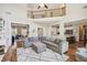 Open living room with second story overlook, neutral colors, and seamless kitchen access at 1005 Anise Ct, Dacula, GA 30019