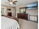 Spacious main bedroom suite boasts ample closet space, large dresser, and modern ceiling fan at 1005 Anise Ct, Dacula, GA 30019