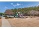 Community playground with slides, climbing structures, and benches in a well-maintained setting at 1005 Anise Ct, Dacula, GA 30019