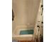Clean white bathtub with white tile surround and a shower curtain at 1075 Peachtree Ne Walk # 506, Atlanta, GA 30309