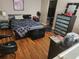Bedroom featuring hardwood floors, updated furniture and a view of the closet at 1075 Peachtree Ne Walk # 506, Atlanta, GA 30309