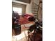 Cozy living room with a spiral staircase, a large window and a red sofa at 1075 Peachtree Ne Walk # 506, Atlanta, GA 30309