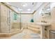 Unique bathroom design with a glass enclosed shower, soaking tub, and pedestal sink at 120 Milano Sw Dr, South Fulton, GA 30331
