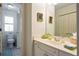 Bright bathroom featuring a toilet in a separate room, a white vanity, and a framed mirror at 120 Milano Sw Dr, South Fulton, GA 30331