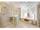 Bright bathroom featuring a soaking tub, large shower, and tile floor at 120 Milano Sw Dr, South Fulton, GA 30331