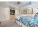 Bedroom with custom built-ins and a floral comforter at 120 Milano Sw Dr, South Fulton, GA 30331