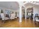 Open-concept dining room with hardwood floors, a chandelier, and elegant furniture at 120 Milano Sw Dr, South Fulton, GA 30331