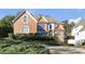 Elegant brick home featuring manicured landscaping and a charming two-story design at 120 Milano Sw Dr, South Fulton, GA 30331