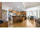 Spacious eat-in kitchen featuring stainless steel appliances, granite countertops, and hardwood floors at 120 Milano Sw Dr, South Fulton, GA 30331