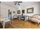 Bright living room with hardwood floors, ceiling fan, and neutral walls at 120 Milano Sw Dr, South Fulton, GA 30331