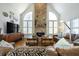 Inviting living room with stone fireplace, high ceilings, and comfortable seating at 120 Milano Sw Dr, South Fulton, GA 30331