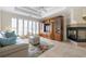 Bright living room with tile floors, fireplace, and custom built-in cabinets at 120 Milano Sw Dr, South Fulton, GA 30331