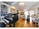 Elegant living room with a grand piano, hardwood floors, and cozy seating at 120 Milano Sw Dr, South Fulton, GA 30331
