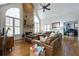 Cozy living room featuring a stone fireplace, hardwood floors, and comfortable sofas at 120 Milano Sw Dr, South Fulton, GA 30331