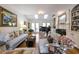 Inviting living room featuring a fireplace, grand piano, and built-in shelving at 120 Milano Sw Dr, South Fulton, GA 30331