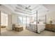 Comfortable bedroom featuring a four-post bed, tray ceiling, and bright windows at 120 Milano Sw Dr, South Fulton, GA 30331