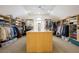 Spacious walk-in closet with custom shelving and storage at 120 Milano Sw Dr, South Fulton, GA 30331