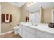 Bathroom with white vanity and large mirror at 402 Silver Summit Se Dr, Conyers, GA 30094