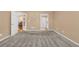Empty bedroom with carpet, neutral paint and two entry doors at 402 Silver Summit Se Dr, Conyers, GA 30094