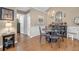 Inviting dining area featuring hardwood floors and a decorative chandelier at 402 Silver Summit Se Dr, Conyers, GA 30094