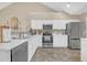 Modern kitchen with stainless steel appliances and light countertops at 402 Silver Summit Se Dr, Conyers, GA 30094