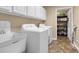 Laundry room with a sink, washer, dryer and storage space at 402 Silver Summit Se Dr, Conyers, GA 30094