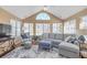Bright living room featuring a vaulted ceiling with many windows at 402 Silver Summit Se Dr, Conyers, GA 30094