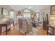 Elegant living room with fireplace, hardwood floors, and large windows offering natural light at 402 Silver Summit Se Dr, Conyers, GA 30094